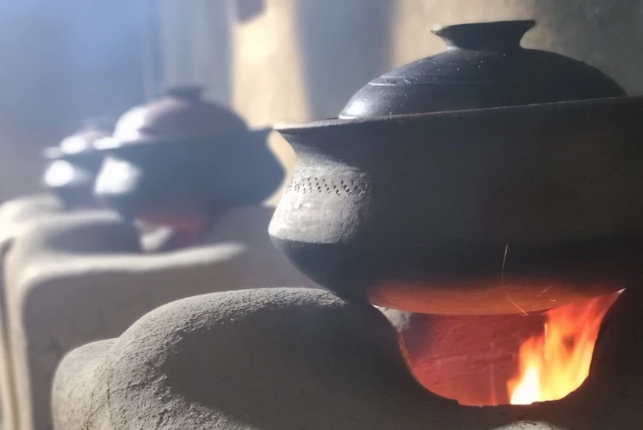 Traditional Sri Lankan clay pot cooking over an open fire